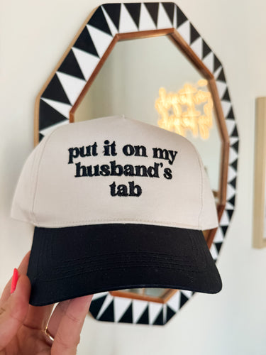 PUT IT ON MY HUSBANDS TAB TRUCKER HAT-BLACK
